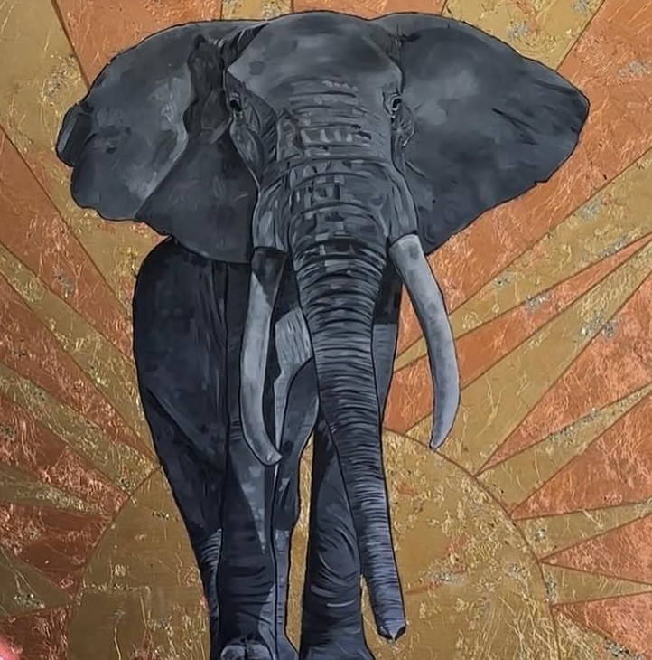 Elephant in charcoal grey against a sunburst of gold and copper leaf